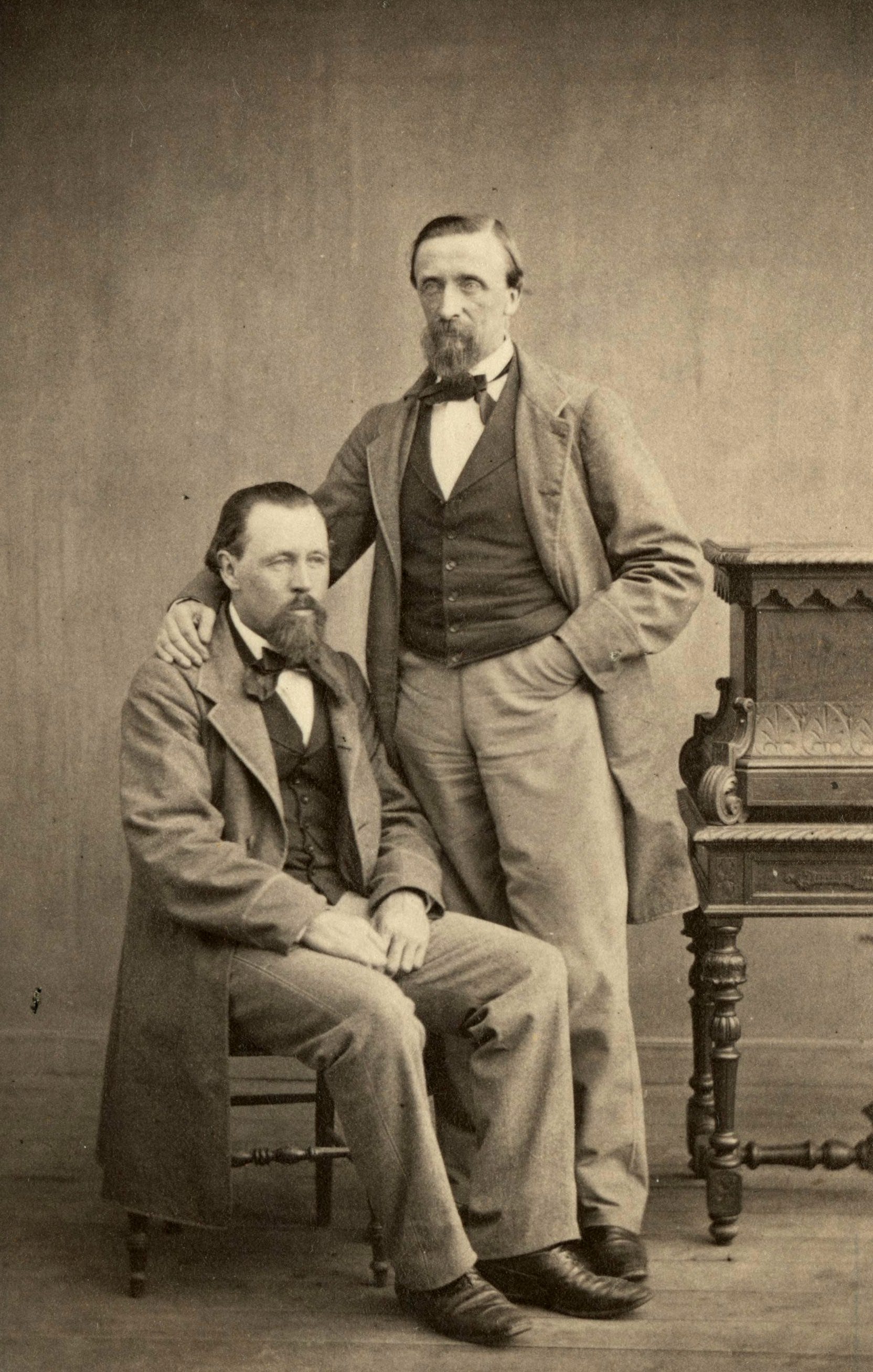 John Lyman Smith seated beside an unidentified man